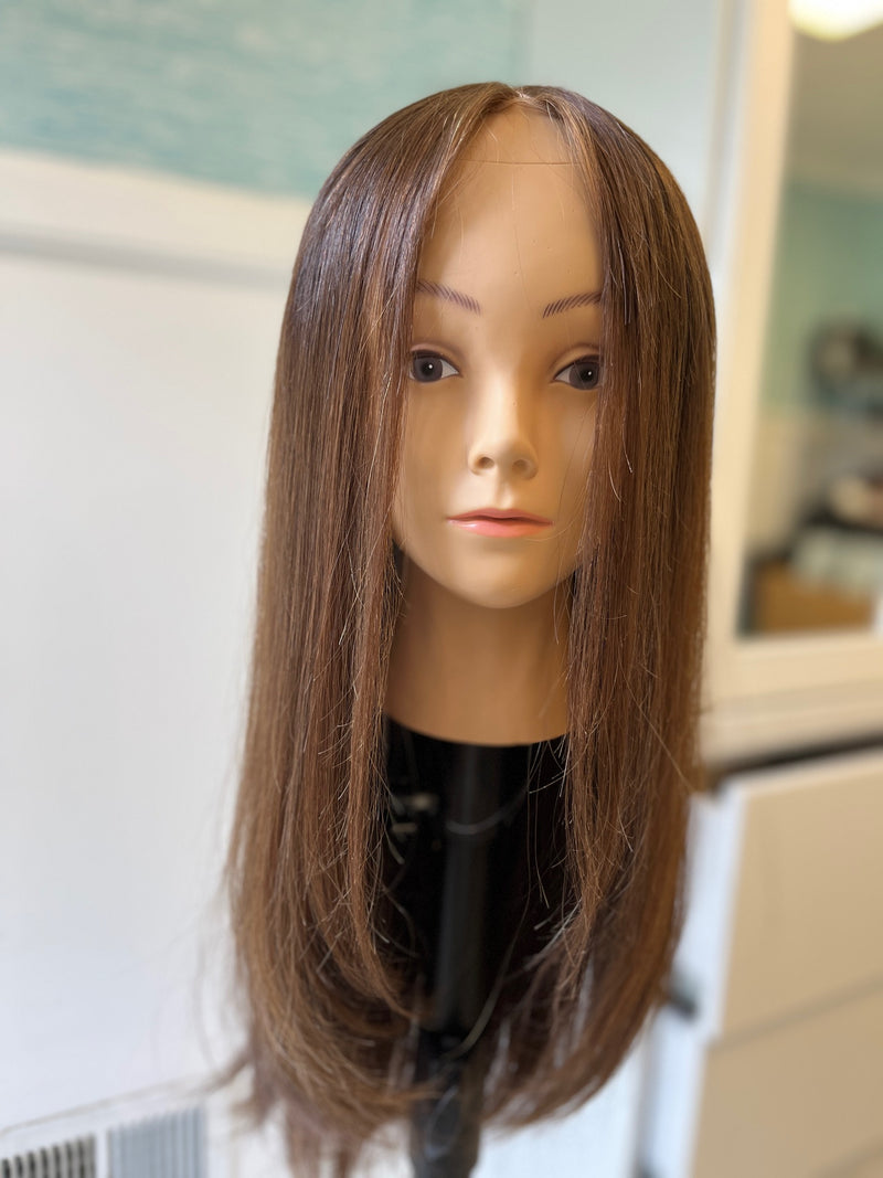 Pre-owned lace-top wig - front view of straight brown layers.