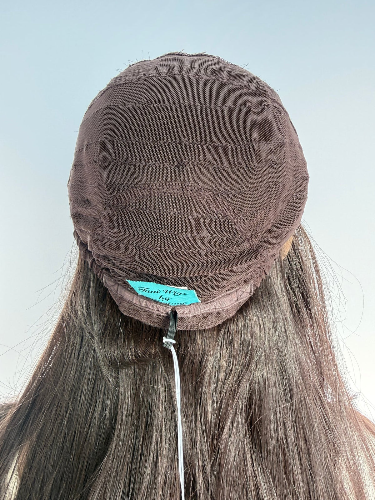 Inside back of the Tuni wig cap with its sewn maker label.