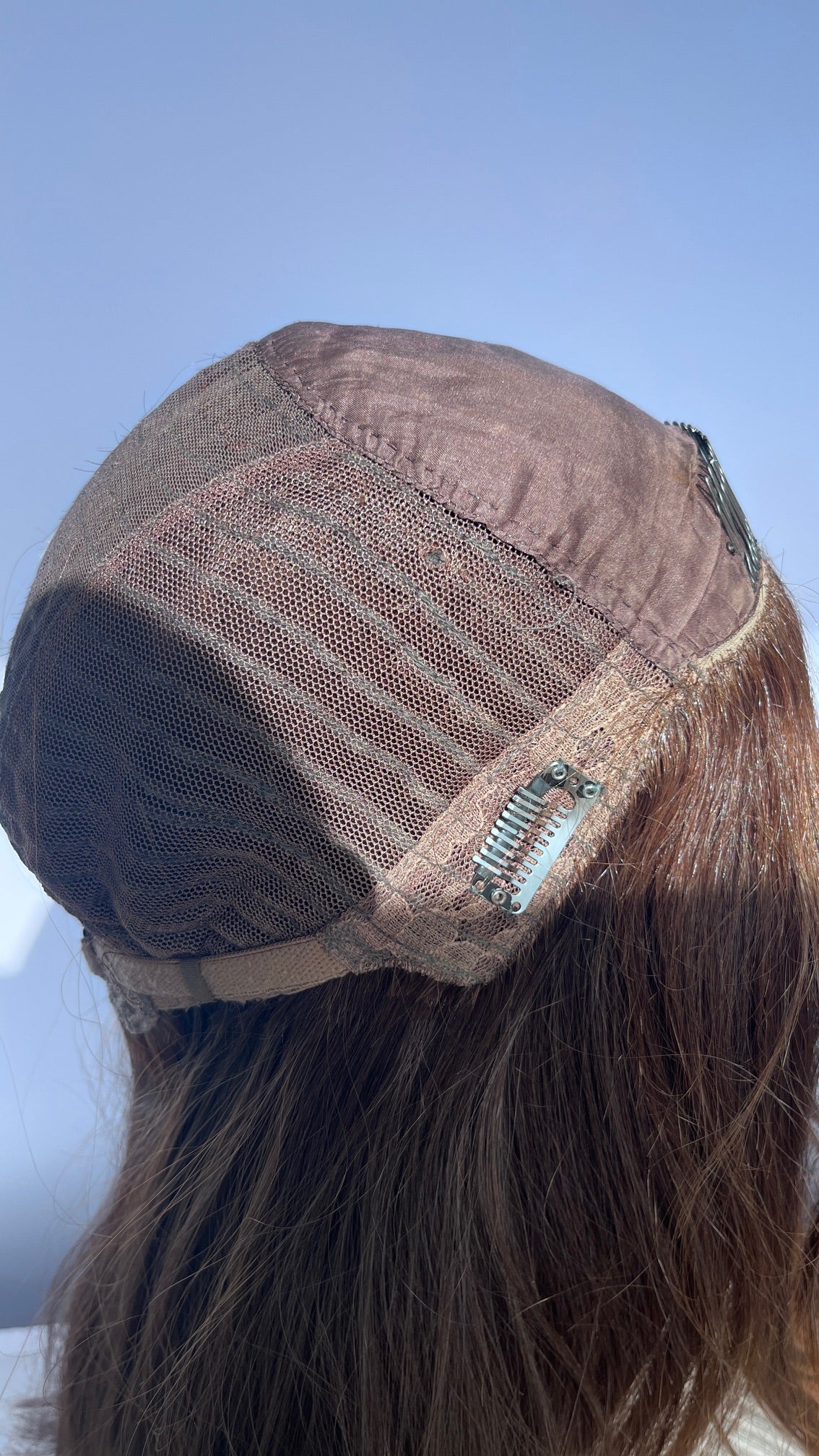 Inside side of the Shevy wig cap showing a clip and mesh.