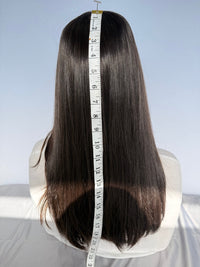 Back of the Tuni wig with a measuring tape beside the hair.