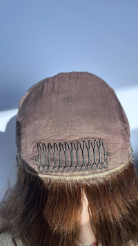 Inside front of the Shevy wig cap showing the lining and comb.