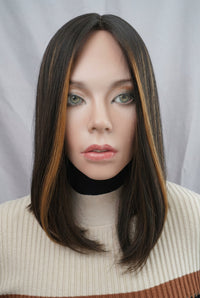 Front view of the pre-owned Gali silk French top wig in dark brown with chunky highlights