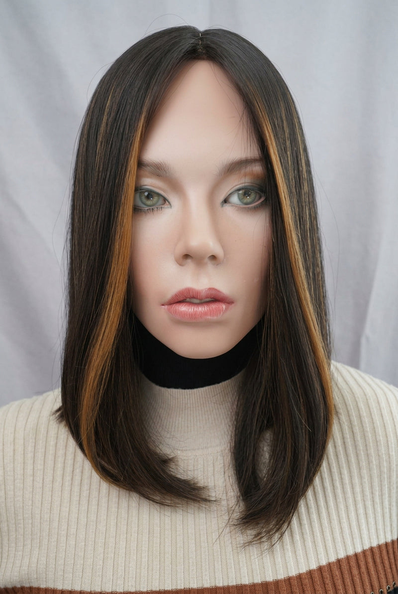 Front view of the pre-owned Gali silk French top wig in dark brown with chunky highlights