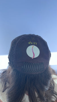 Inside front of the Sari Luxe wig cap showing its brand label.
