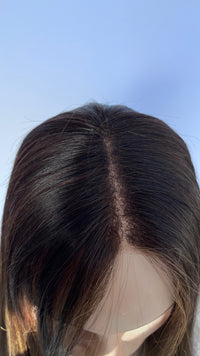 Close-up of the Mazali wig's center part and crown