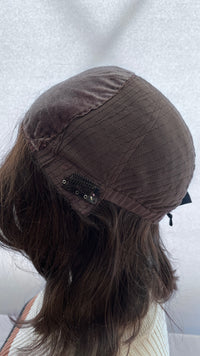 Opposite inside view of the Fortune wig's cap and clip