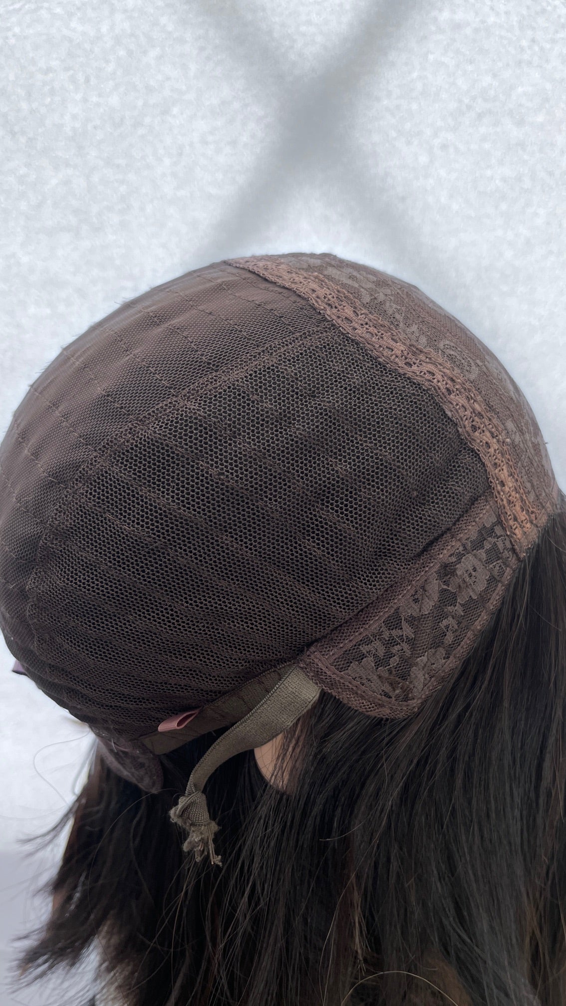 Inside side of the Gali wig cap showing the loose elastic end