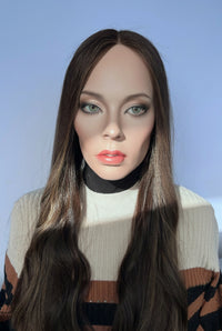 Front view of the pre-owned Mazali lace top wig in medium brown with highlights