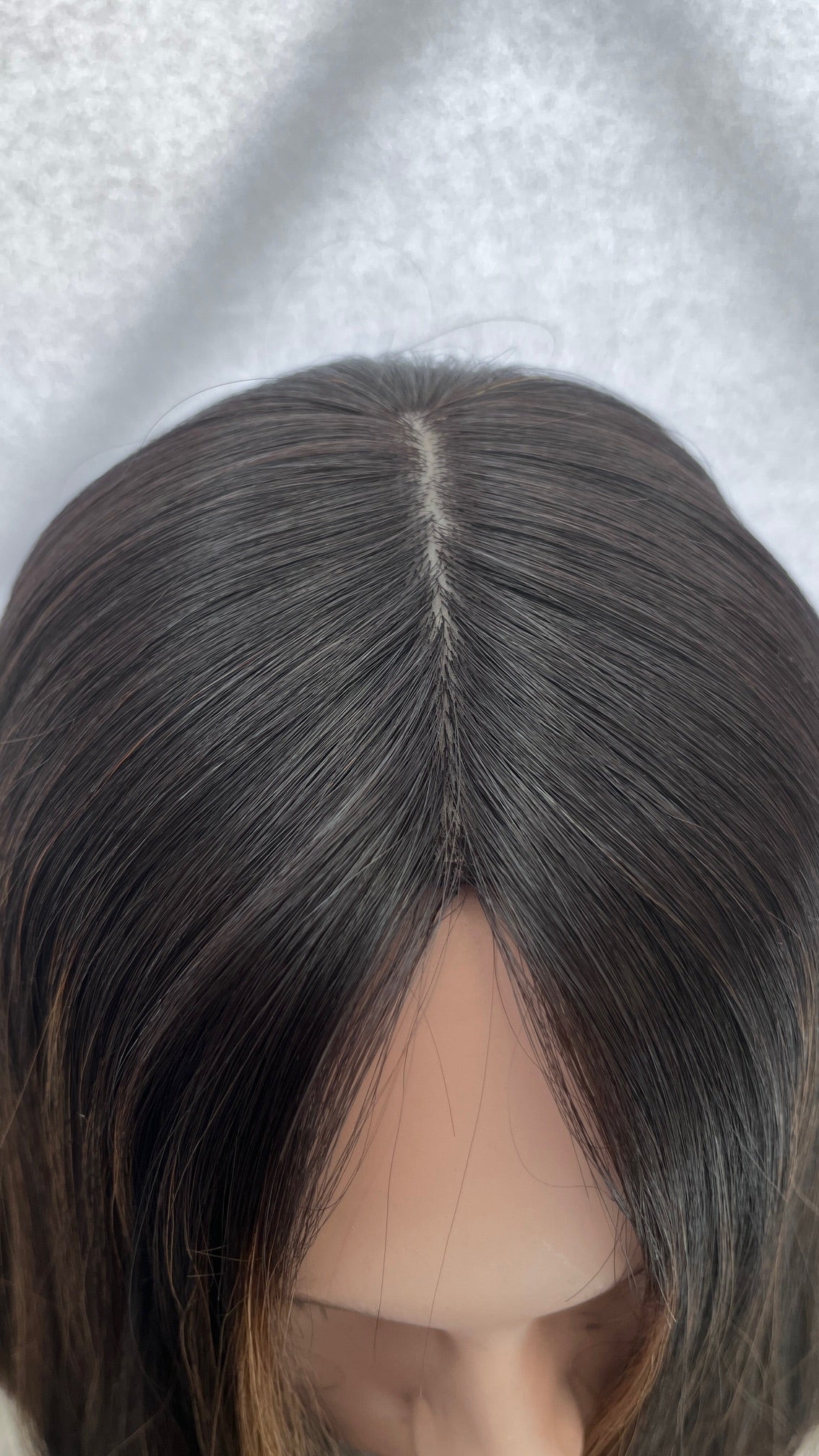 Close-up of the Gali wig's center part and crown