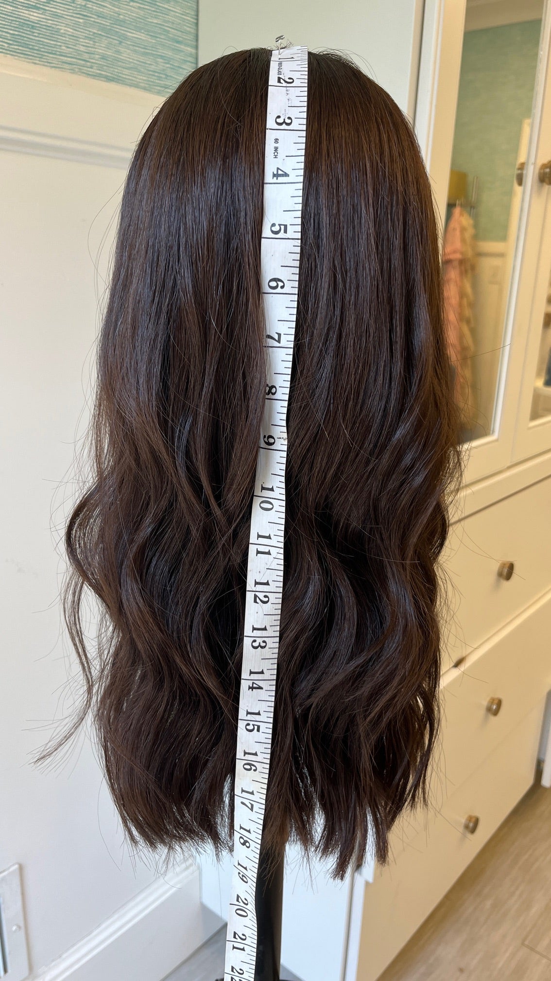 Pre-owned band fall - back view with a measuring tape.