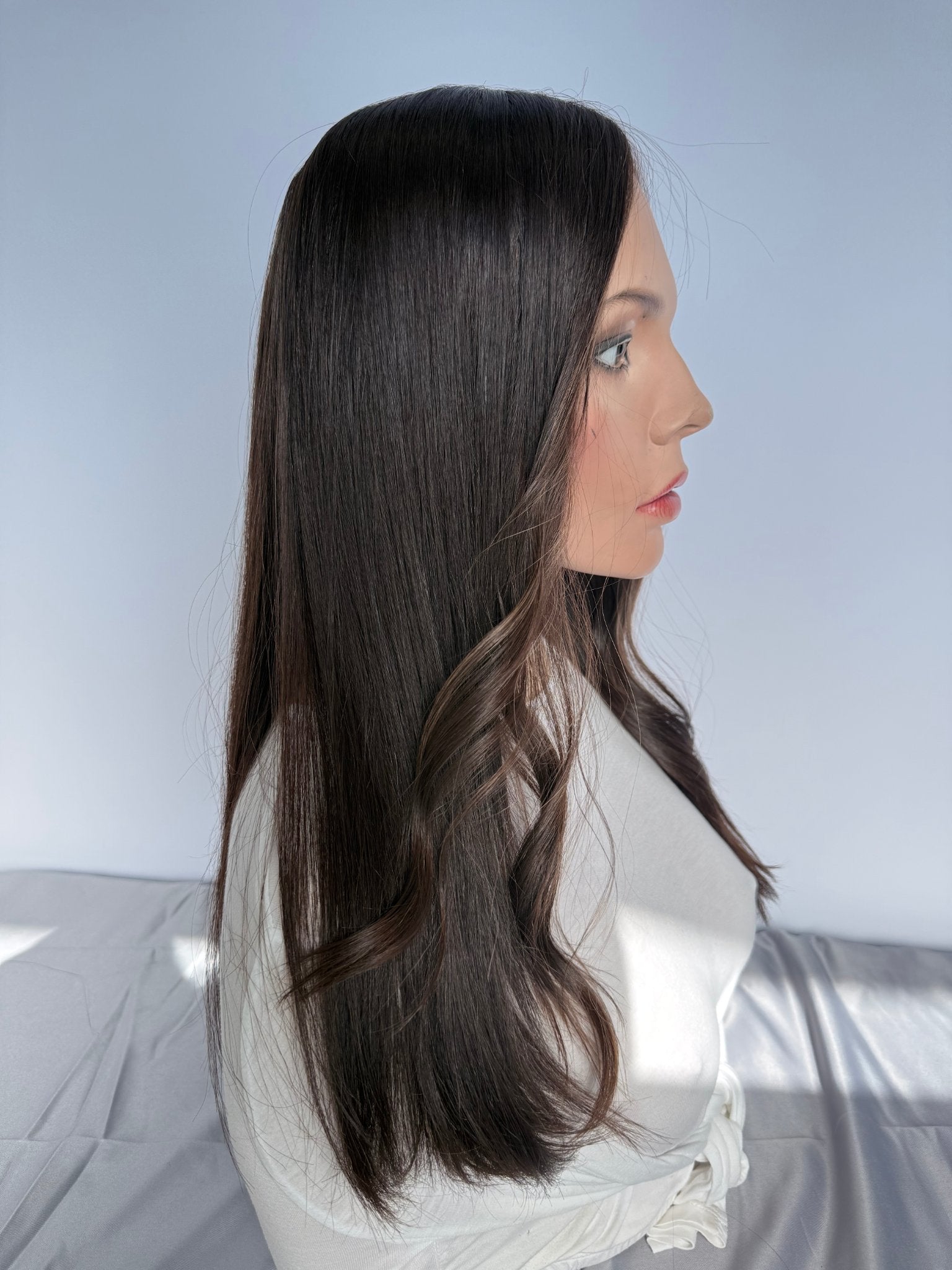 Tuni lace front wig on a mannequin, side view showing styled waves.