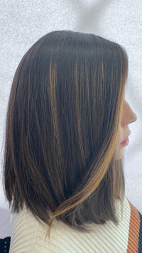 Side view of the Gali silk French top wig facing right