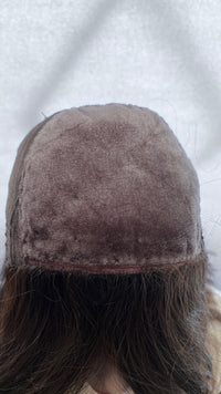 Inside front view of the Fortune wig's silk panel, showing surface pilling and edge wear