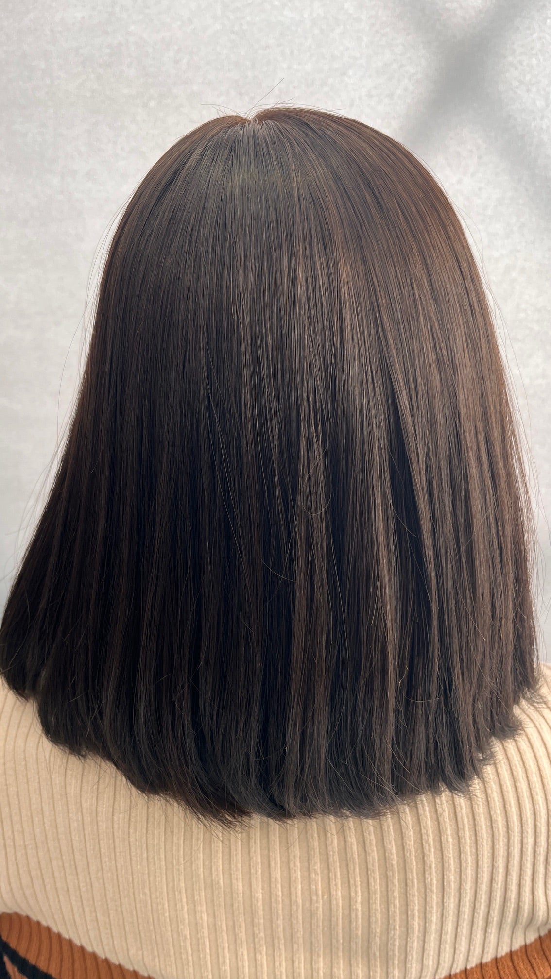 Back view of the dark brown Fortune wig's blunt cut