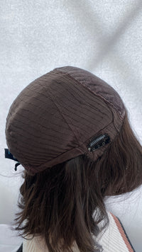 Inside side view of the Fortune wig's mesh cap and clip