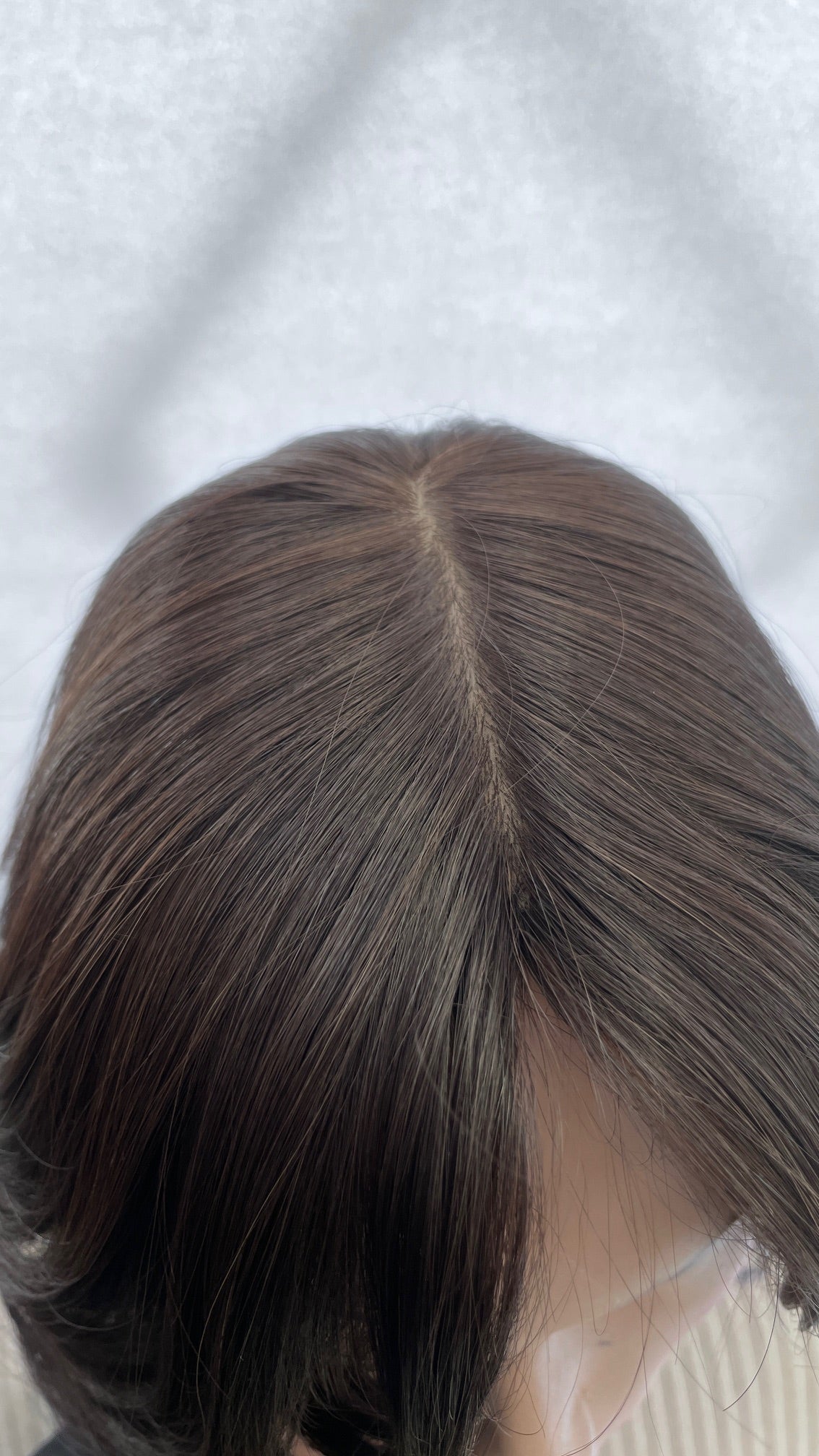 Close view of the Fortune wig's crown and parting