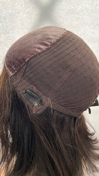 Opposite inside view of the Fortune wig's cap and clip