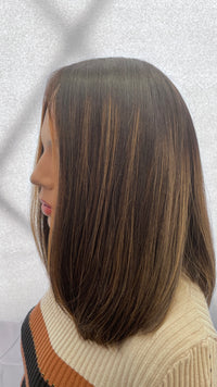 Side view of the Gali silk French top wig facing left