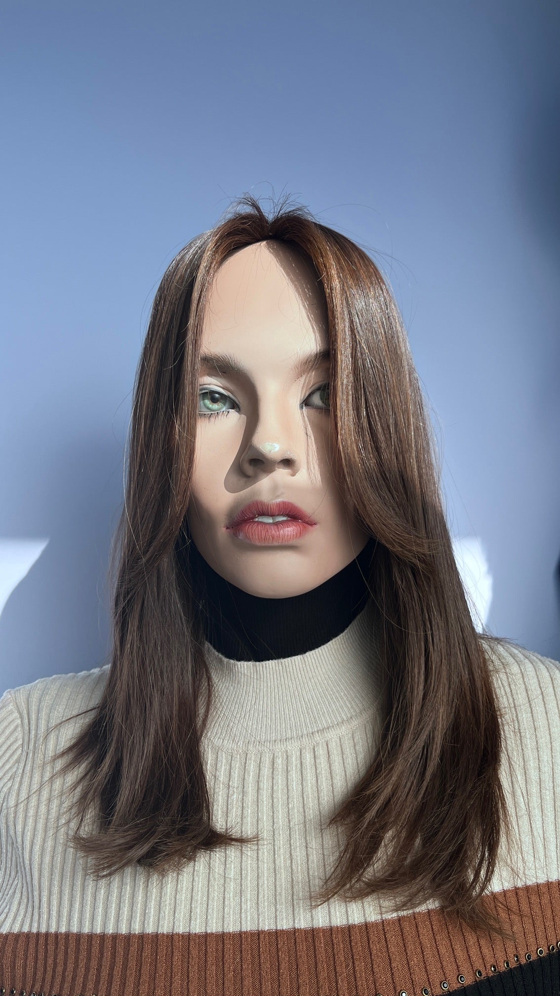 Front view of the Shevy wig with curtain bangs and face-framing layers.